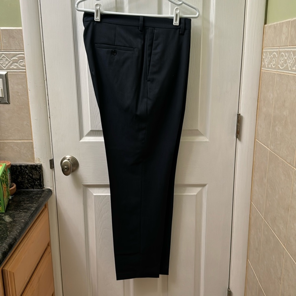 H&M. Slim fit navy slacks: 33x32. Poly/cotton.